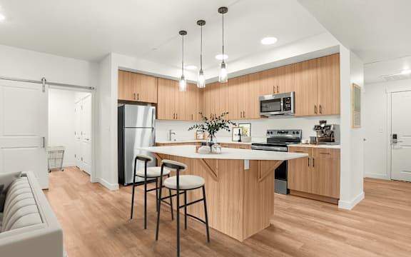 A kitchen with wooden cabinets and a white countertop.
