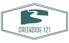 A logo with a stylized letter S in a teal color is on a white background with the text "CREEKSIDE 121" below it.