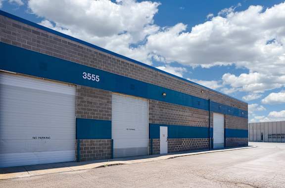 A blue and white building with the number 3555 on it.