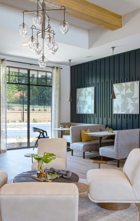 a living room filled with furniture and a chandelier