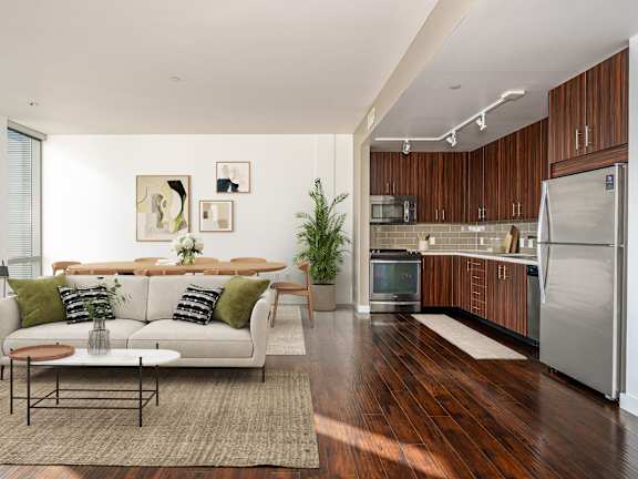 A modern living room with a white couch and a coffee table.