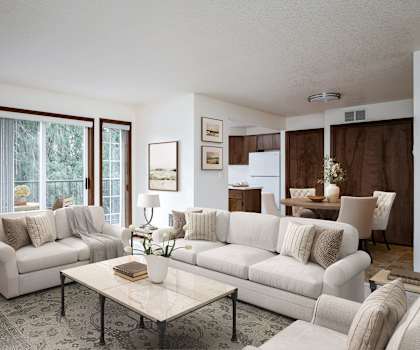 a living room filled with furniture and a large window