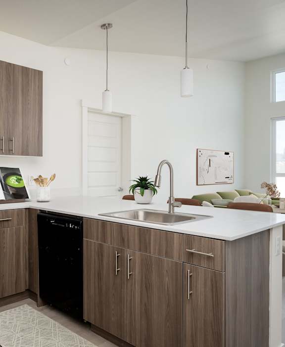 A modern kitchen with a black oven and microwave, wooden cabinets, and a white countertop.