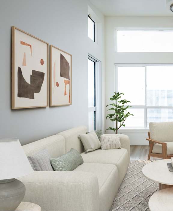 A living room with a couch, chair, and a table.