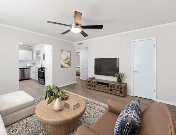 a living room with a ceiling fan and a coffee table in the middle of the room  at Sunset Heights, San Antonio, TX