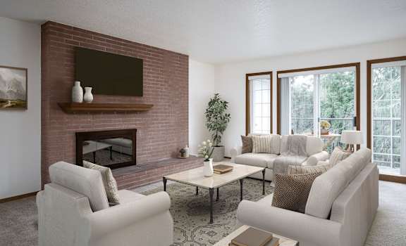 a living room with white furniture and a brick fireplace
