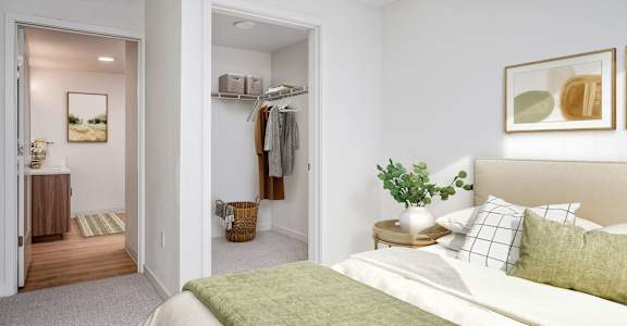 a bedroom with a bed and a closet and a bathroom