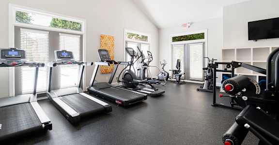 A gym with treadmills at Dunwoody Glen in Dunwoody, GA, 30360