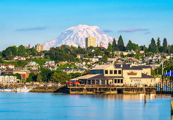 a view of the city with a mountain in the background