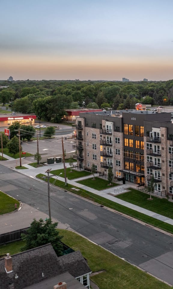 an aerial view of an apartment building on a city street