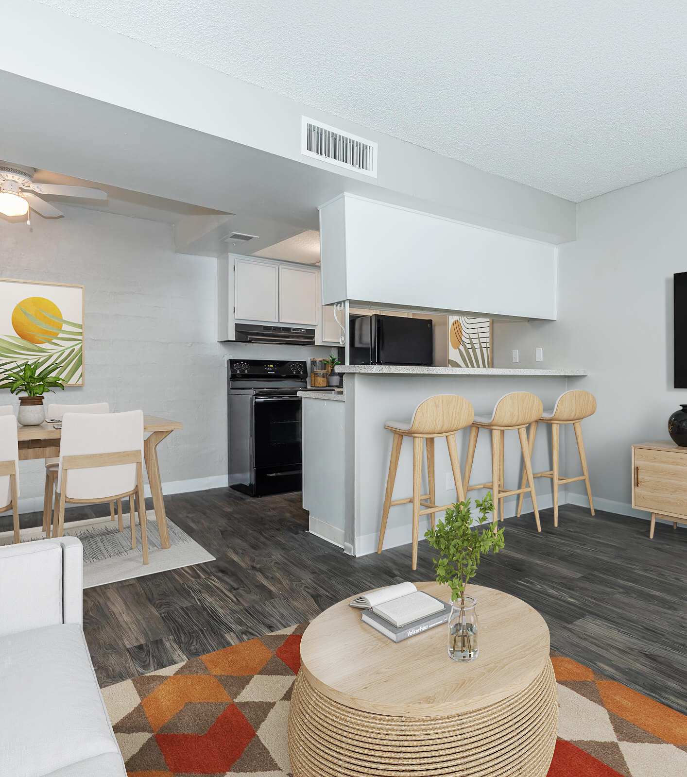 Furnished apartment living area shown at The Cara Apartments.