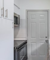 a kitchen with a sink and a door