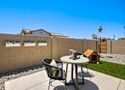 Thumbnail 5 of 7 - Patio with chairs and dog house at Avilla Enclave, Mesa, 85212