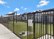 Thumbnail 3 of 6 - A dog park with a sign that says "Austin Dog Park".