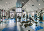 Thumbnail 29 of 53 - Lenexa Apartments for Rent-Waterside Residences at Quivira Apartments Spacious Gym With Updated Machines And Views Of Property  at Waterside Residences on Quivira, Kansas
