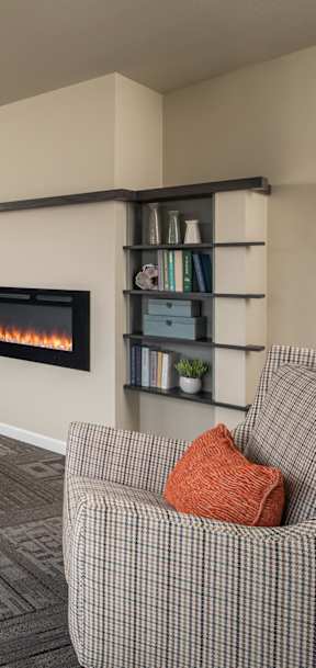 A living room with a fireplace and a couch.