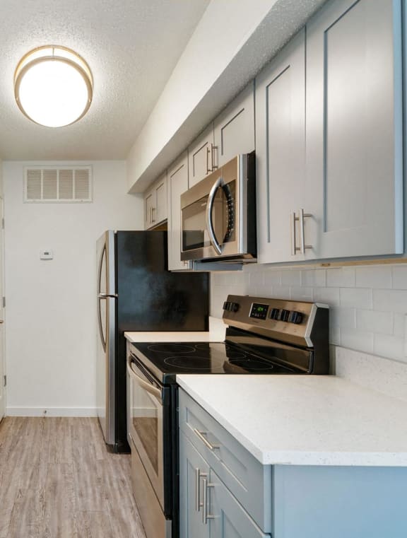 a kitchen with stainless steel appliances and a sink