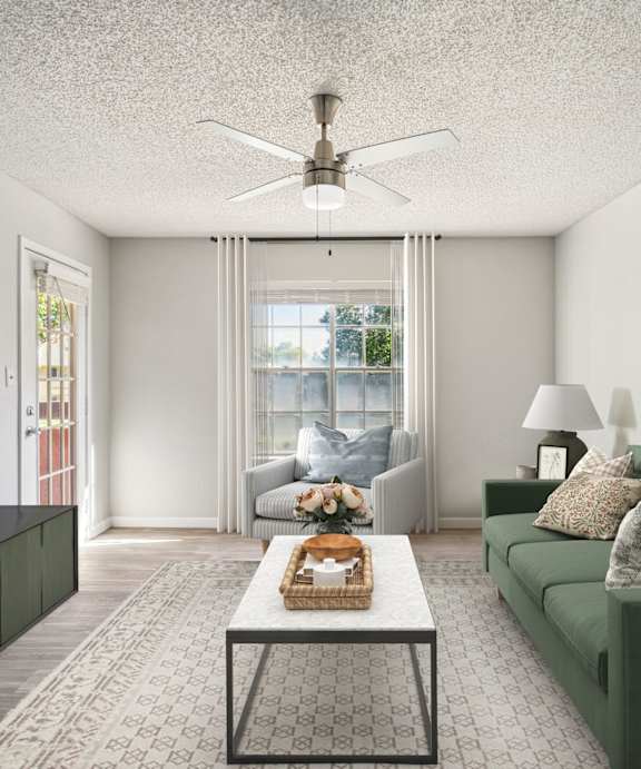 A living room with a green couch and a coffee table.