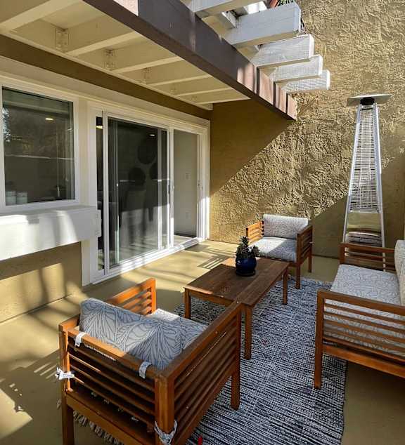 Patio with couch at Bella Del Mar Apartments, Del Mar