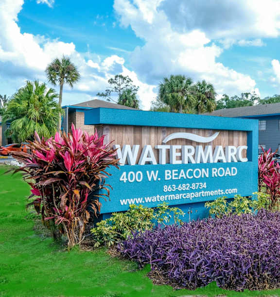 A street view of a building with a sign that says "Breukemore Apartments".