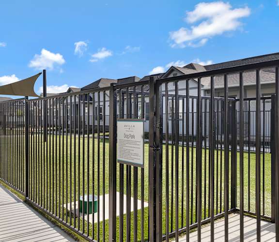 A dog park with a sign that says "Austin Dog Park".