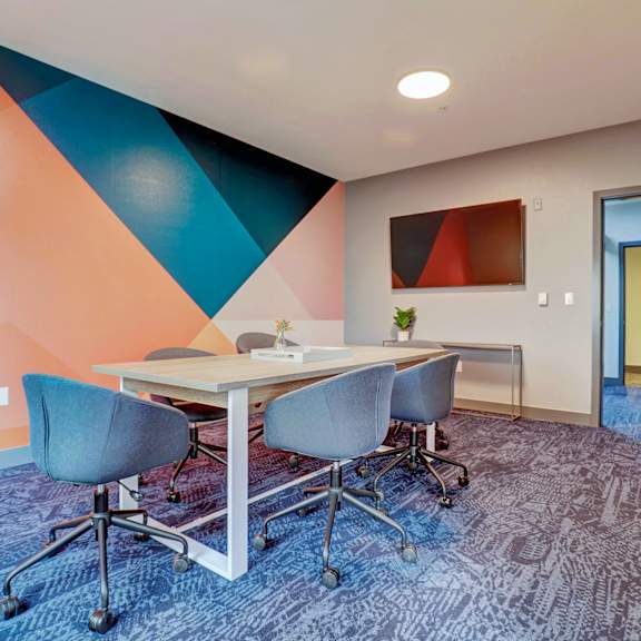a conference room with a table and chairs