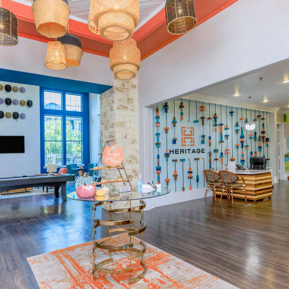 the interior of a living room with a glass table