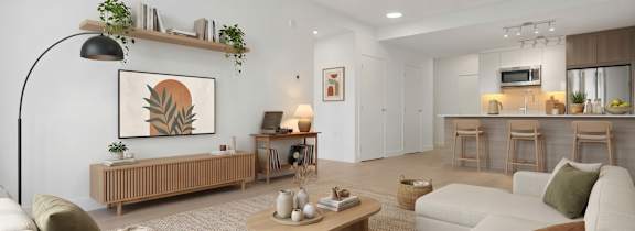 A living room with a white couch, a wooden coffee table, and a painting on the wall.