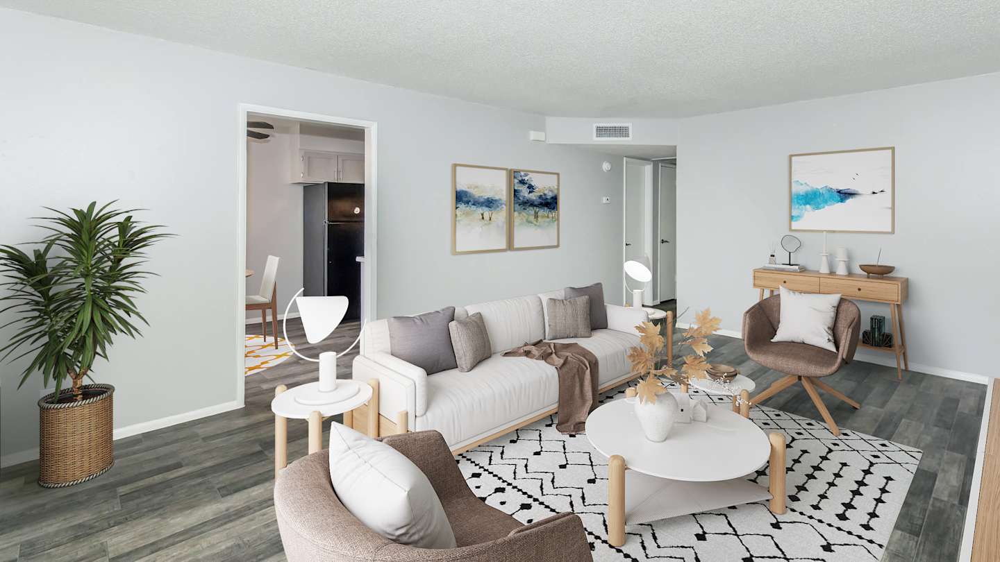 Furnished apartment living area shown at The Cara Apartments.