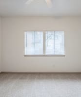 a clean kitchen with white cabinets and a sink