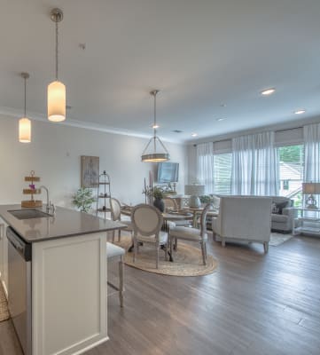 a kitchen and dining area in a 555 waverly unit