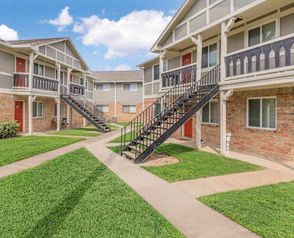 an image of an apartment building with a geometric design at Castlewood Apartments, Clute, TX