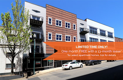 A building with a sign offering a free month with a 13-month lease.