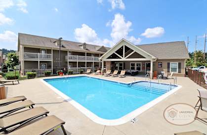 our resort style swimming pool is next to our building with lounge chairs