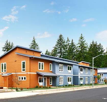 a row of colorful houses on the side of a street