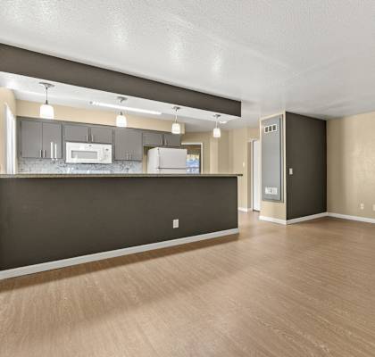 A kitchen area with a countertop and cabinets.at Redwood Cove Apartments, Chico, CA