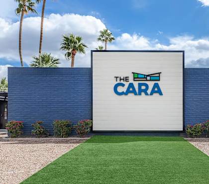 The CARA sign is displayed on a blue wall.