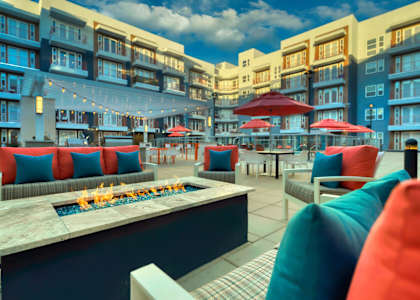 a lounge area with a fire pit at a building with apartments at The Rey Downtown, Phoenix, 85003