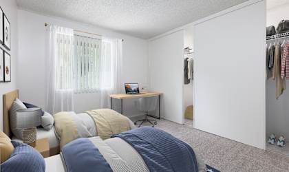 a bedroom with two beds and a wardrobe