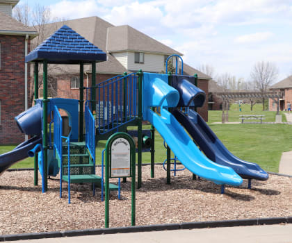 Children's playground with slides at Fountain Glen Apartments in Lincoln, NE