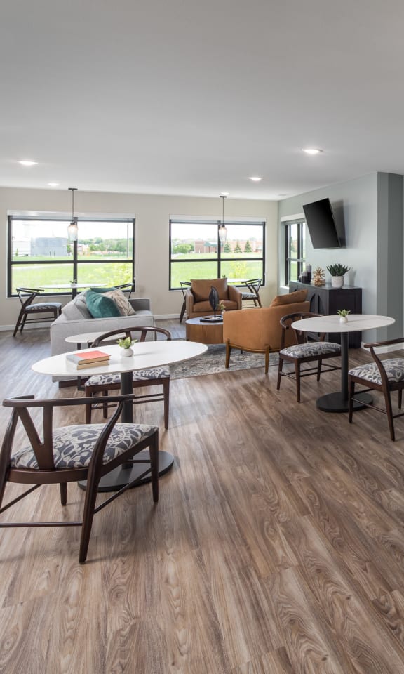 an open kitchen and living room with a table and chairs