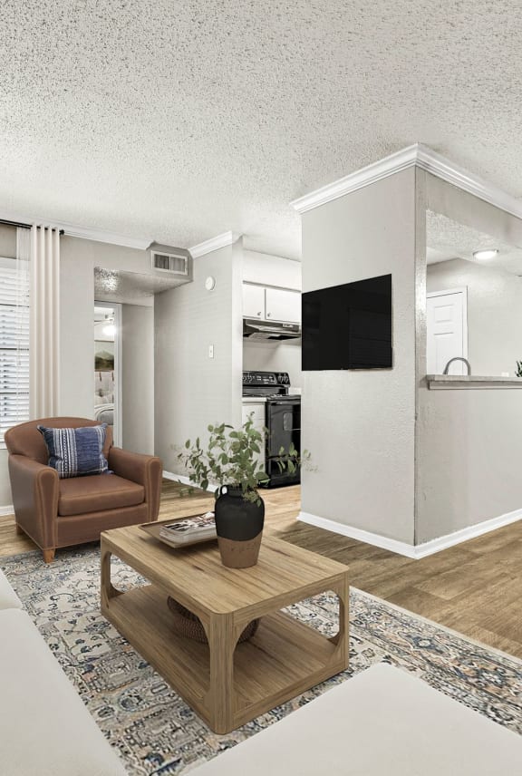 a living room with a couch and a table  at 5636 Apartment Homes, Texas, 75254