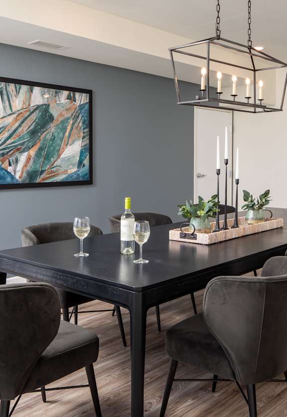 an image of a dining room with a table and chairs