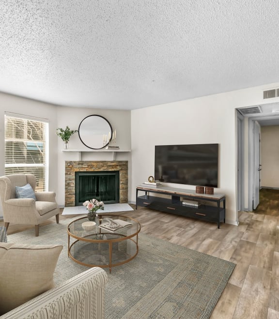 a living room with a fireplace and a tv at Vesper, Texas, 75254