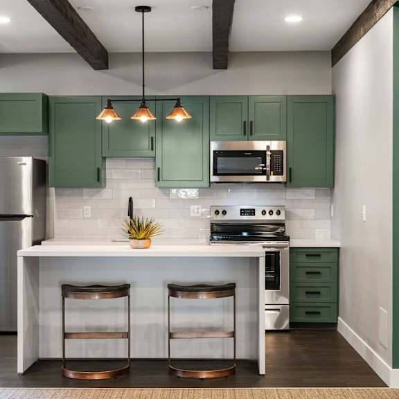 Renovated kitchen clubhouse at Trailgrove Apartments in Denver, CO with flexible space for resident activities.