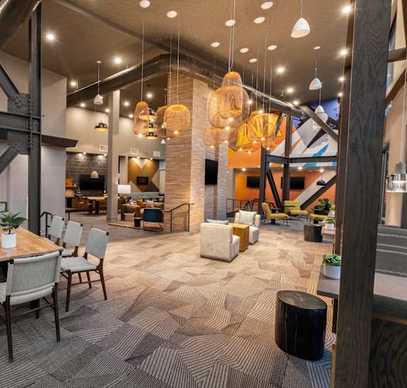 a rendering of the lobby of a restaurant with tables and chairs
