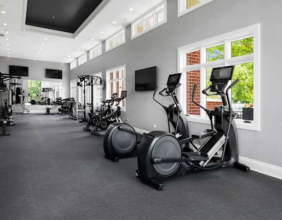 A spacious gym with a variety of exercise equipment.