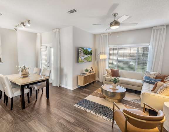 A living room with a dining table and chairs. at The Estates at Brentwood, Brentwood, TN, 37027
