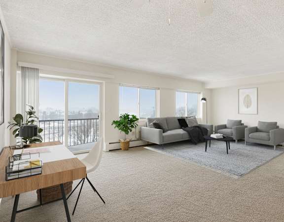 A living room with a grey sofa set and a grey rug. at Park Towers, St. Louis Park, MN