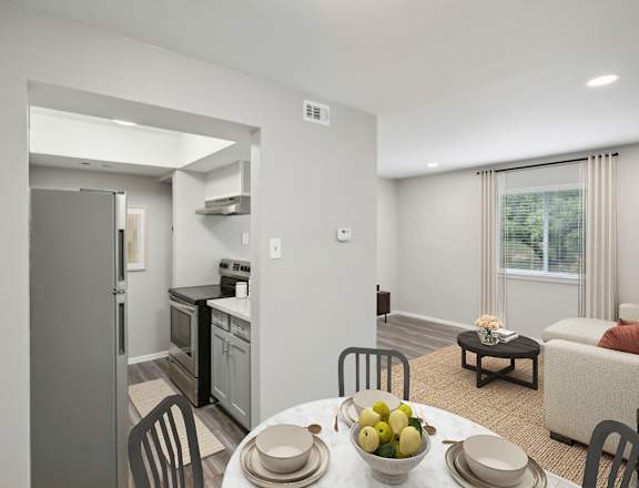 a kitchen and living room with a table and chairs at The Keller, Texas